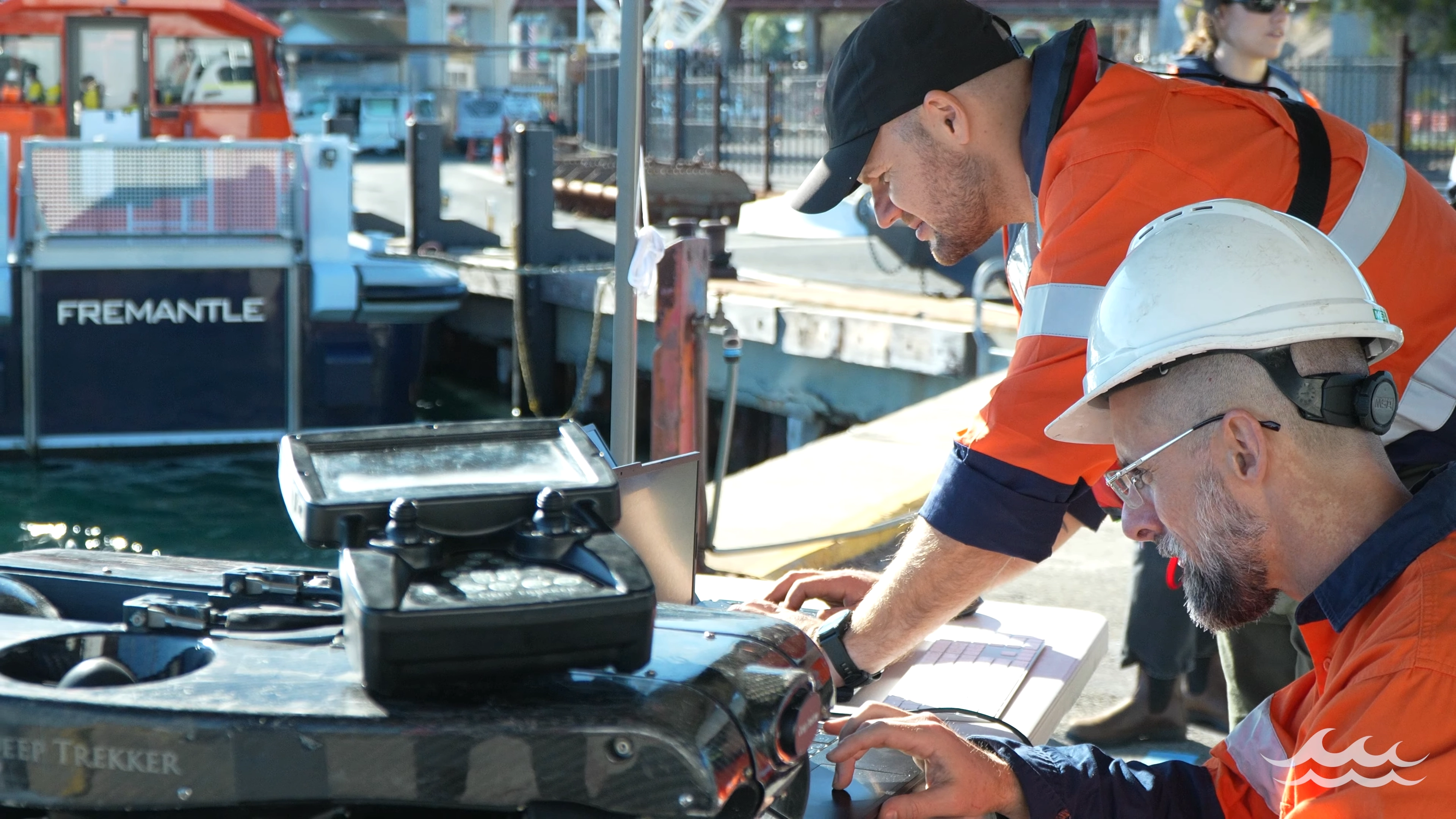 Team reviewing ROV footage